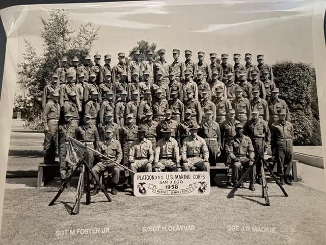 Black-and-white group portrait of U.S. Marines; sign reads "PLATOON 3-53 U.S. MARINE CORPS SAN DIEGO 1958"