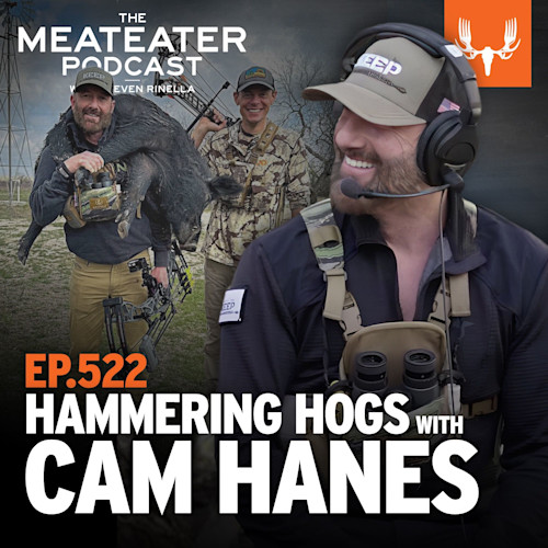 EP.522 HAMMERING HOGS WITH CAM HANES — man with headset foreground, hunters and hog in background