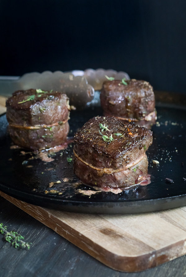 Danielle Prewett from Wild + Whole displays steak served on cast iron. 