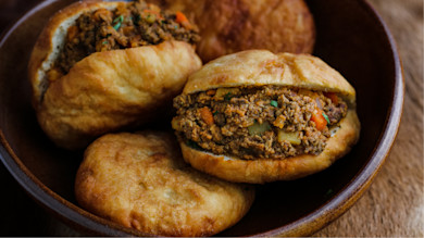 Bowl of fried buns stuffed with seasoned ground venison and diced vegetables