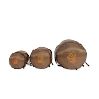 Three brown First Lite compression sacks labeled SM, MD, LG