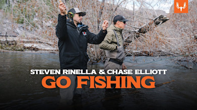 Two men fly-fishing in a river; text overlay: STEVEN RINELLA & CHASE ELLIOTT GO FISHING