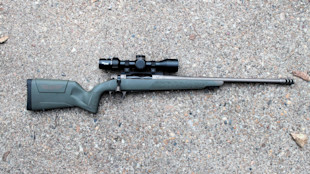 Bolt-action rifle with scope, green synthetic stock and muzzle brake