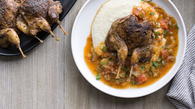 Roasted woodcock on creamy grits with Creole tomato-butter sauce and scallions