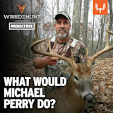 Hunter holding a buck with large antlers in leaf-strewn woods; overlay text "WHAT WOULD MICHAEL PERRY DO?"