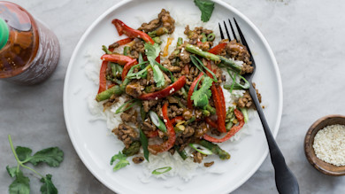 Ground venison stir-fry with asparagus, red bell pepper, scallions and sesame on white rice
