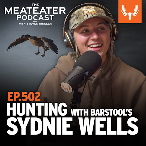 MEATEATER PODCAST — EP.502 HUNTING WITH BARSTOOL'S SYDNIE WELLS; smiling guest in camo cap and headset at mic