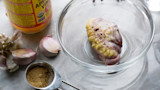 Turkey tail in glass bowl with garlic, 1 Tbsp seasoning and jar labeled "APPLE CIDER VINEGAR"