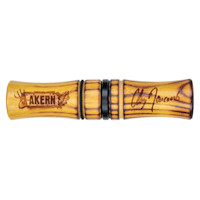 Wooden game call engraved AKERN, signed "Clay Newcomb", with black spacer ring and cord