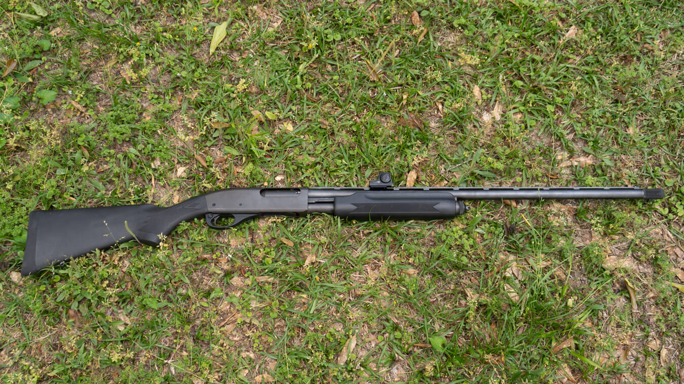 20-gauge pump-action shotgun with black synthetic stock and long barrel