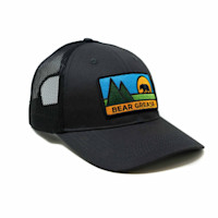 Black mesh trucker hat with patch reading "BEAR GREASE" showing bear, mountains, and sun