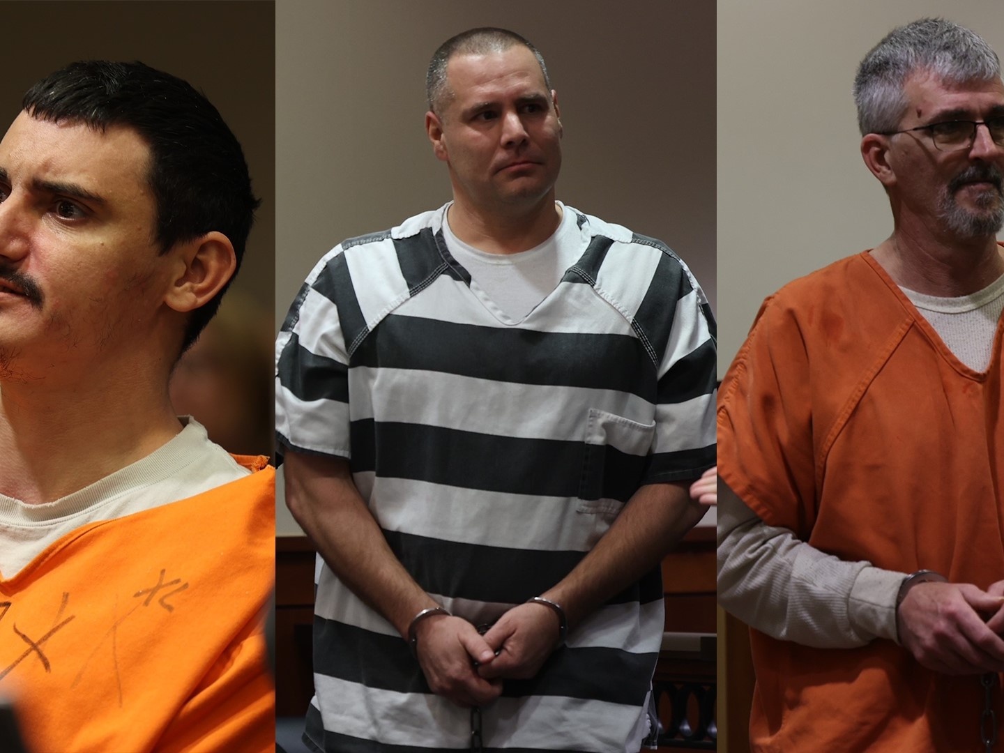 Three men in courtroom wearing jail uniforms; center man in black-and-white striped uniform, handcuffed.