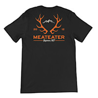Black T-shirt back with orange elk-antler graphic, numbers '20' '12', and text 'MEATEATER' and 'Bozeman, MT'