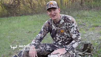 Janis Putelis in camo wearing First Lite cap; overlay text 'Janis Putelis' 'HOW TO GUT A TURKEY'