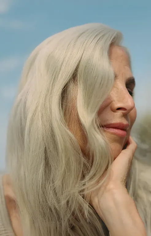 An older woman with beautiful shiny hair