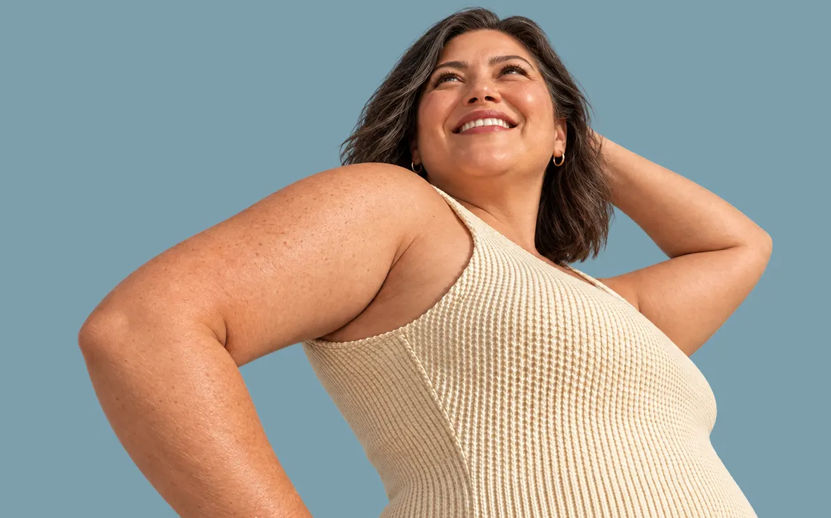 A confident woman posing in a swimsuit