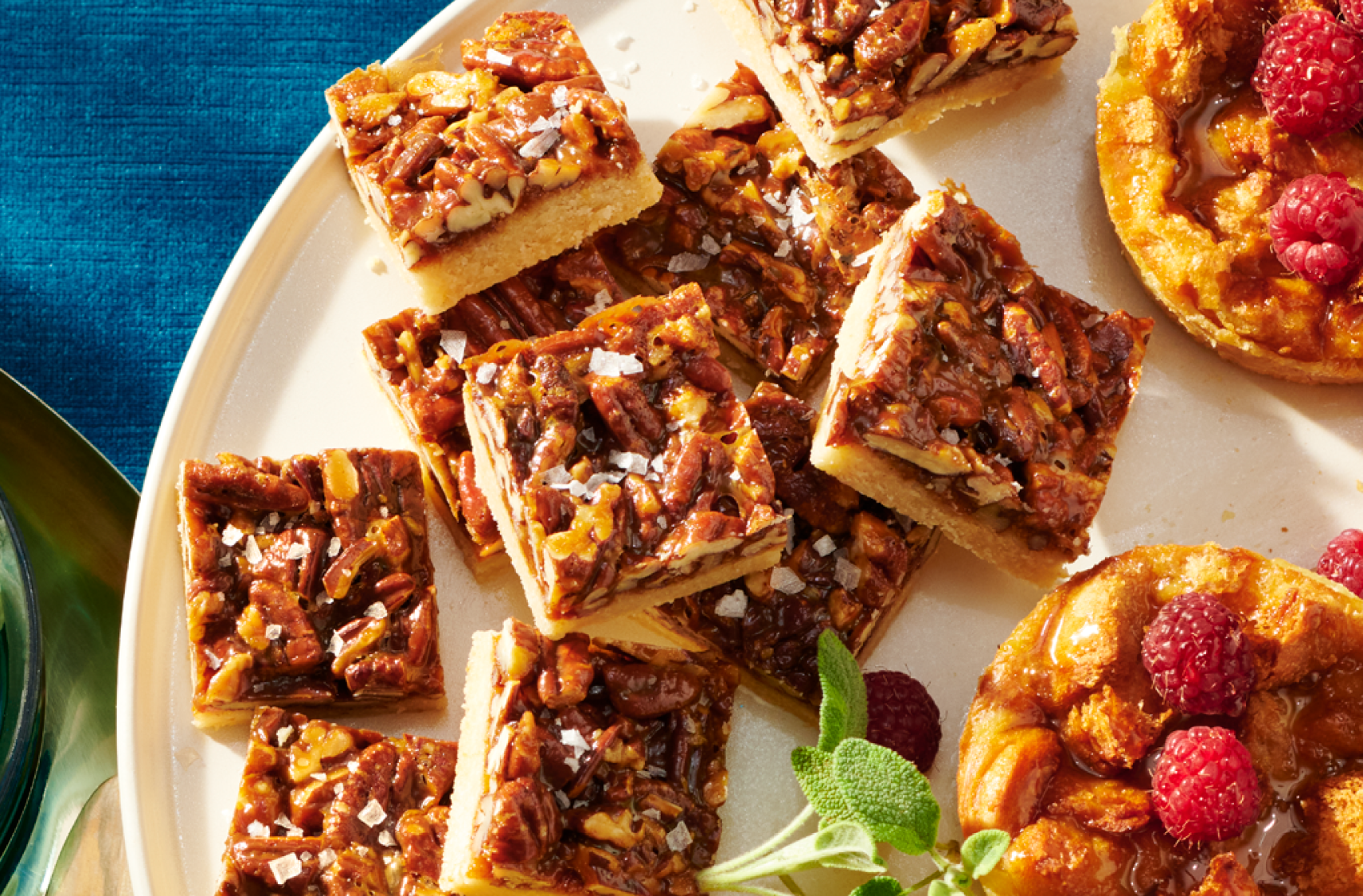 A platter of assorted PC holiday desserts including Dulce de Leche and Pecan Bars with Flaky Sea Salt