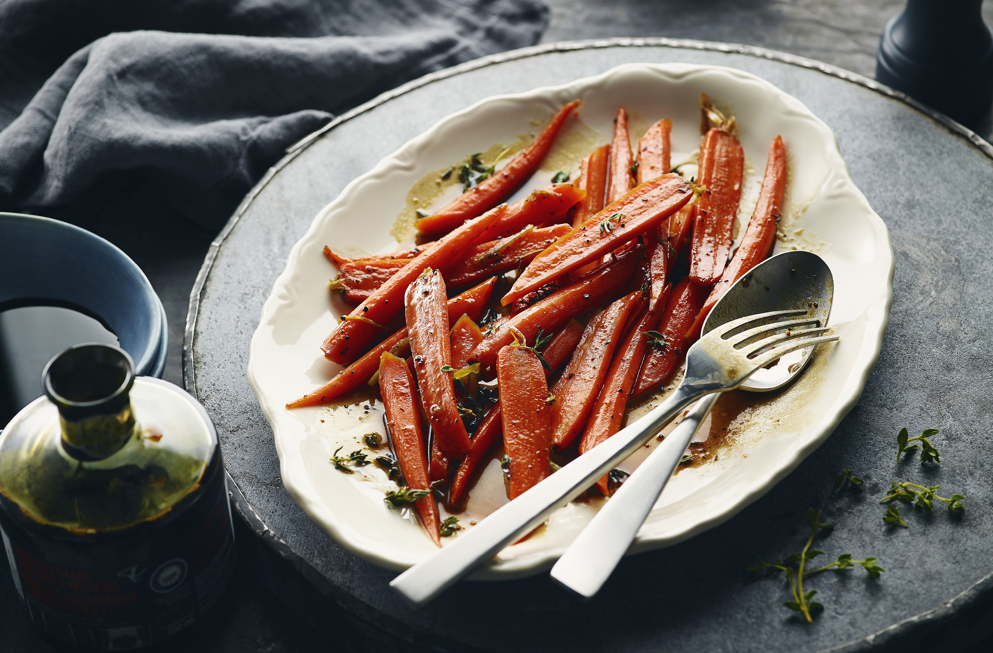 A large plate full of balsamic vinegar glazed carrots