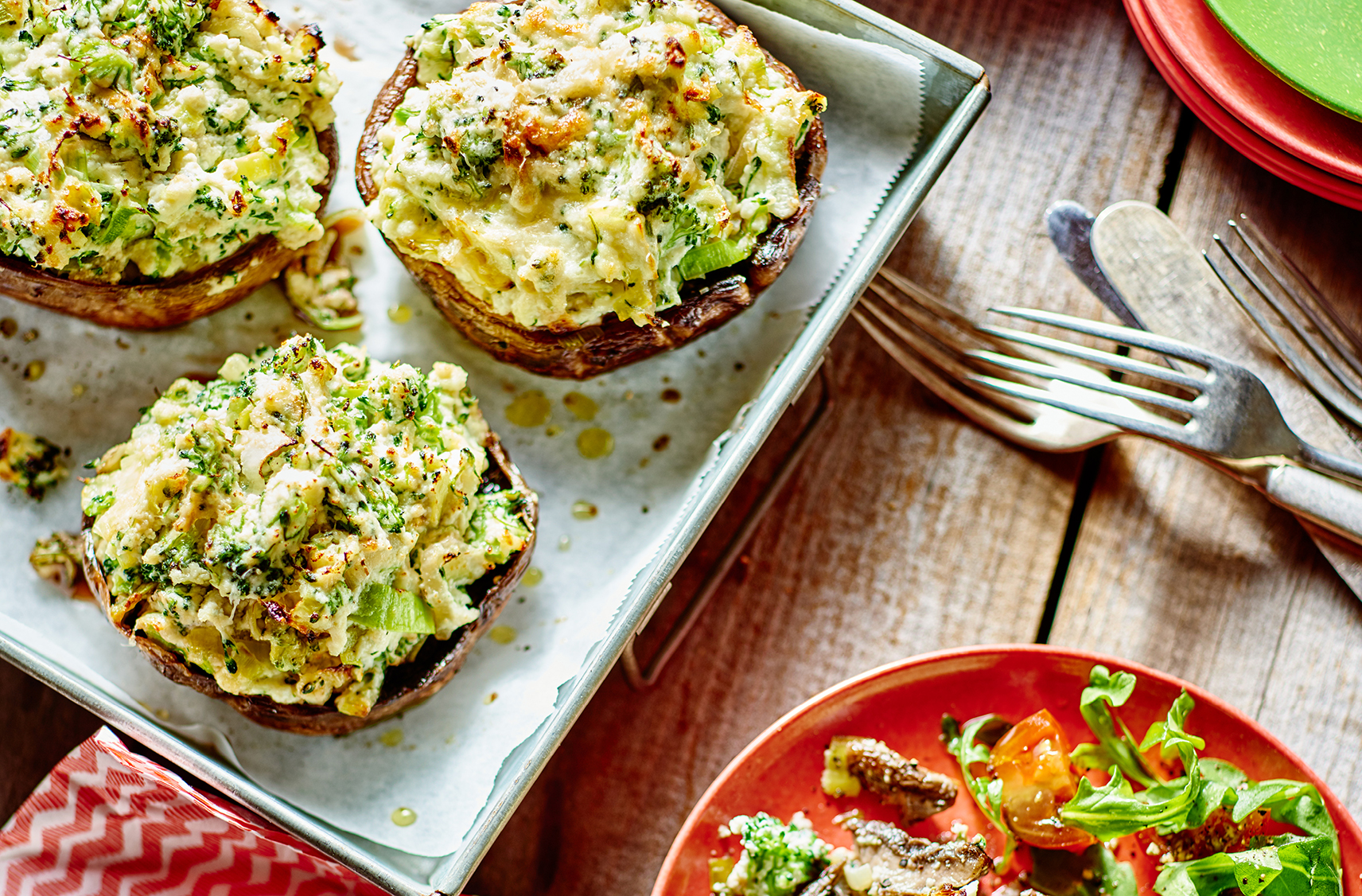 Three baked broccoli stuffed portobello caps