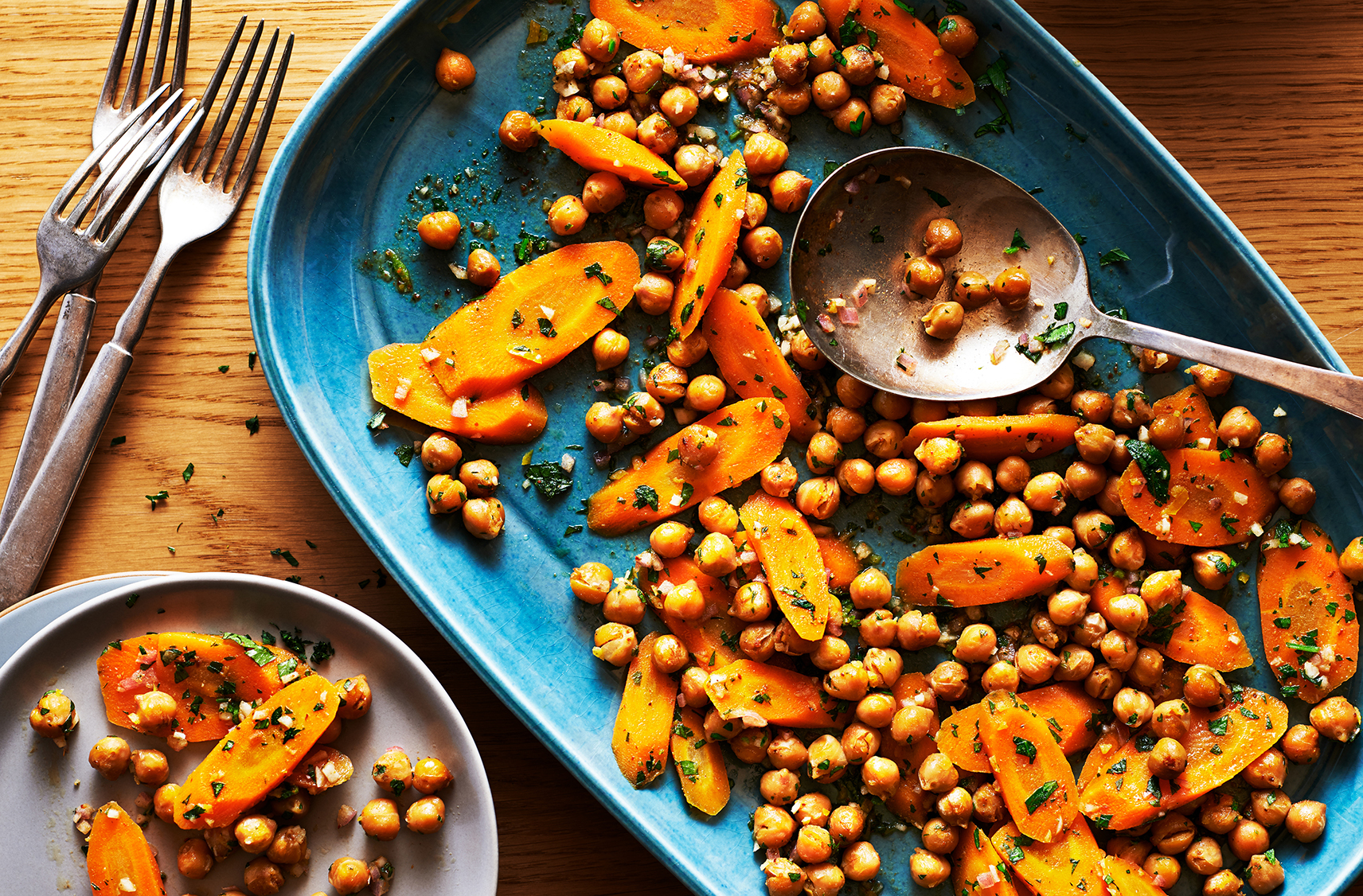Small glasses filled with Moroccan carrot and roasted chickpea salad
