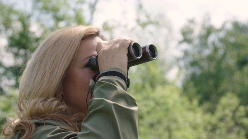 CL Companion Nomad Purpose Carina Schiestl-Swarovski looking through binocular 