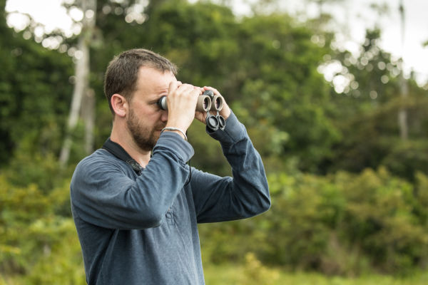 Will Bolsolver using Swarovski Optik binoculars in the Congo. 