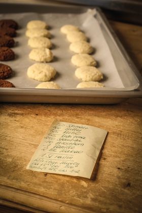 Wild boar lard nuts for Christmas, ingredients and cherry-sized balls on a baking tray