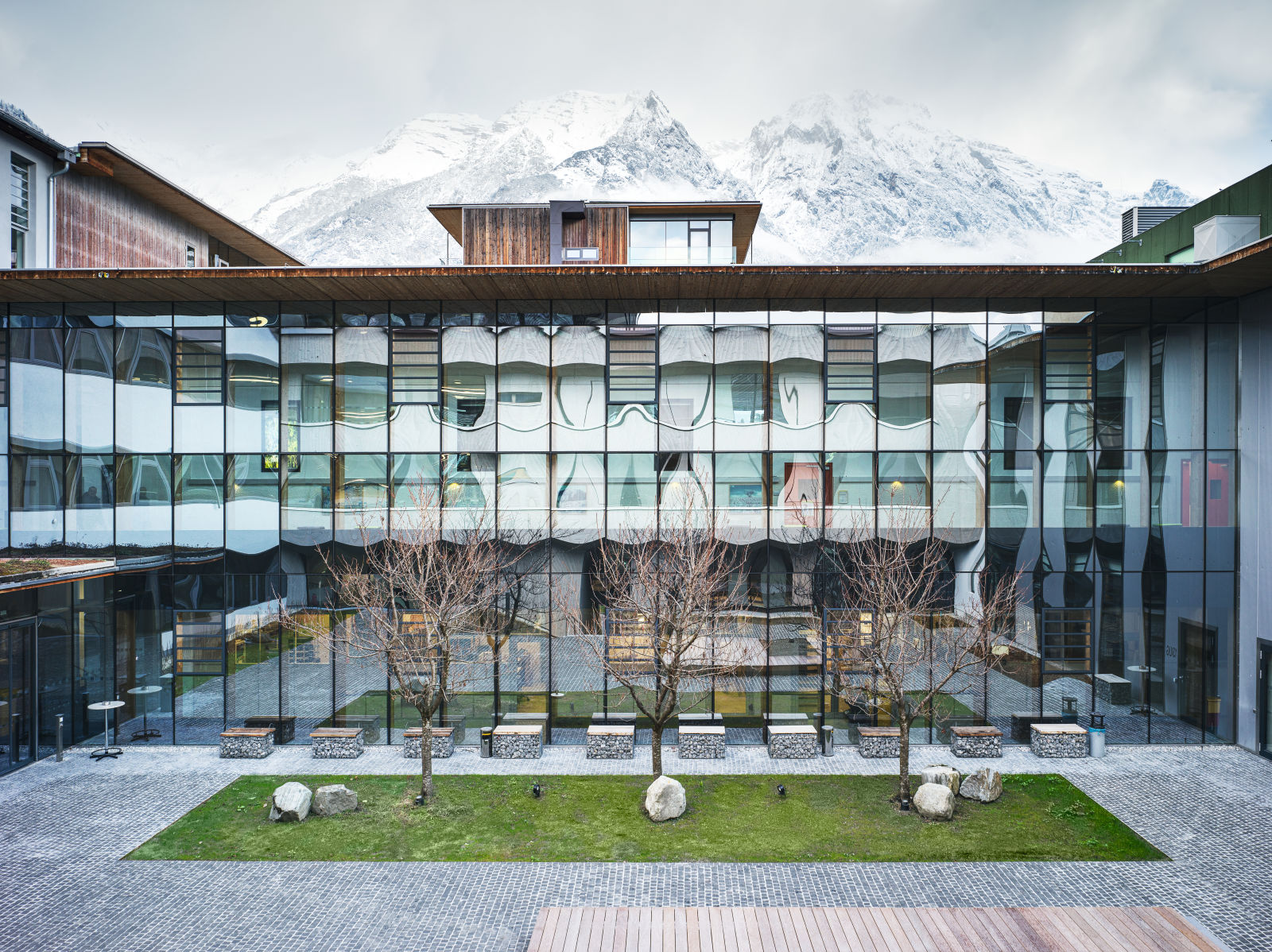 The south view of SWAROVSKI OPTIK's company site, in the background the Bettelwurf in Absam, Tyrol