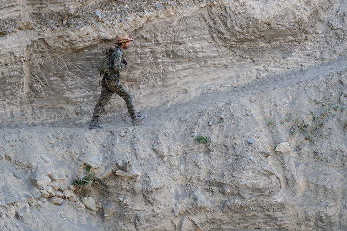 Swarovski Optik New perspectives – Tajikistan man walking on mountain landscape mountain conservation