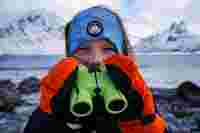 Astrid bird watching in Lofoten, Norway.