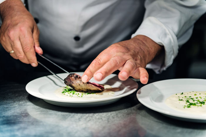 Swarovski Optik APPRECIATING THE GIFTS OF NATURE Robert Niederkofler preparing dish. from the wild to the table