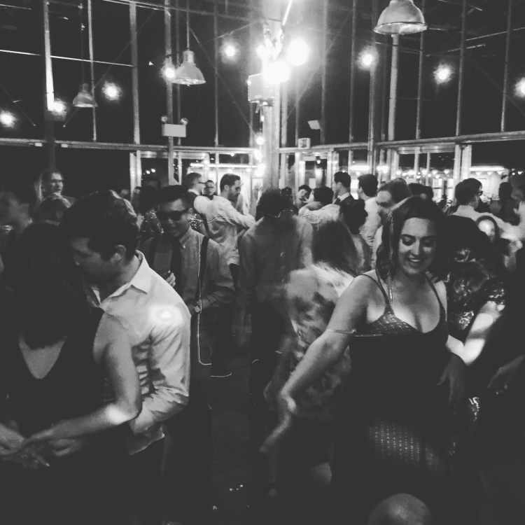 Wedding guests dancing to music by DJ Audeos at the UW Botanic Garden venue "Wisteria Hall"