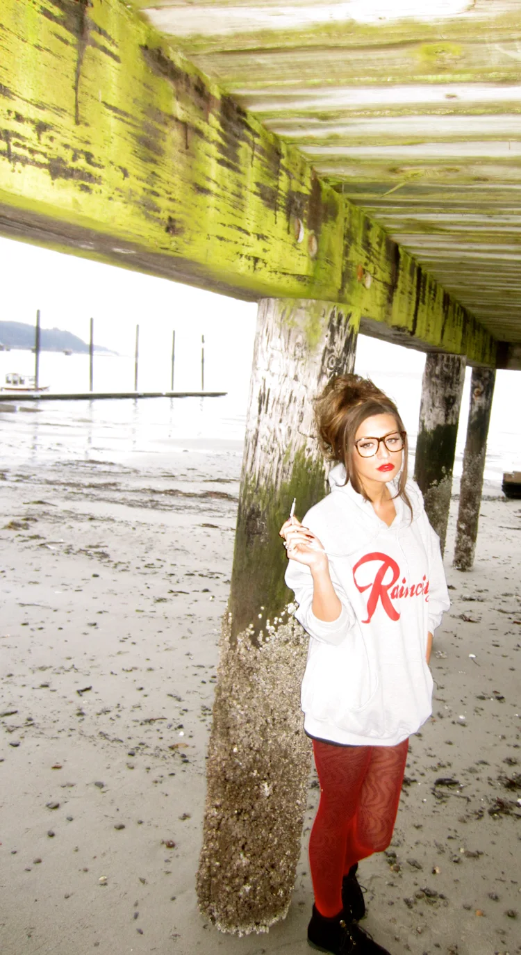 cassandra-mcclure-the-north-west-raincity-hoodie-under-pier-mossy-pilings