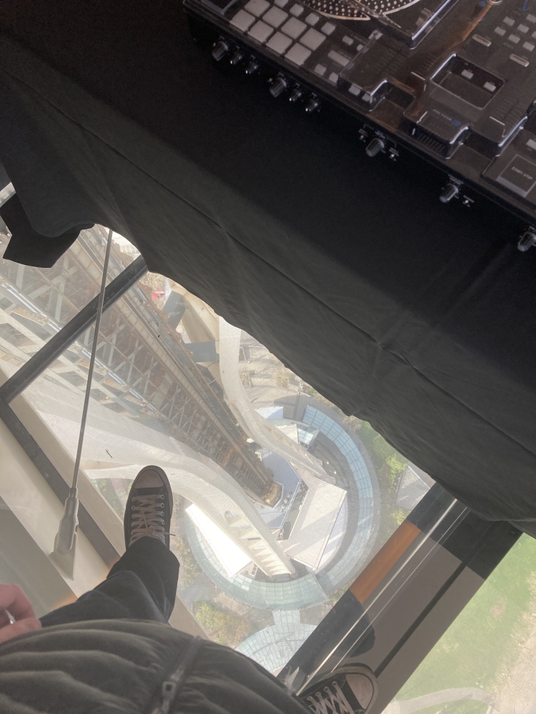 Glass floor view to the ground from the DJ booth at The Space Needle event space