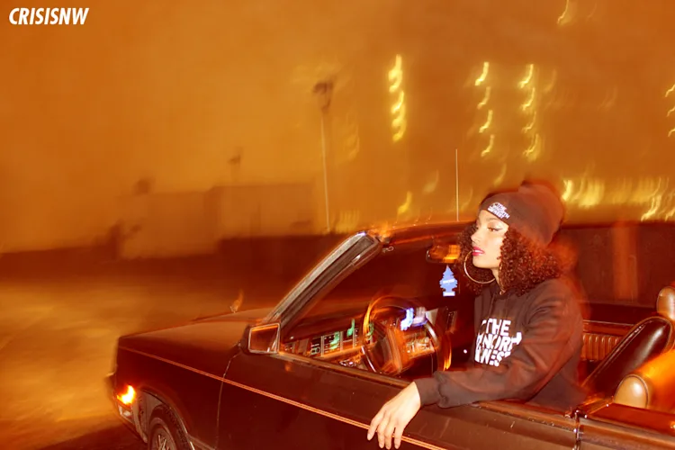 neko-jamilla-the-north-west-hoodie-leaning-out-convertible-window