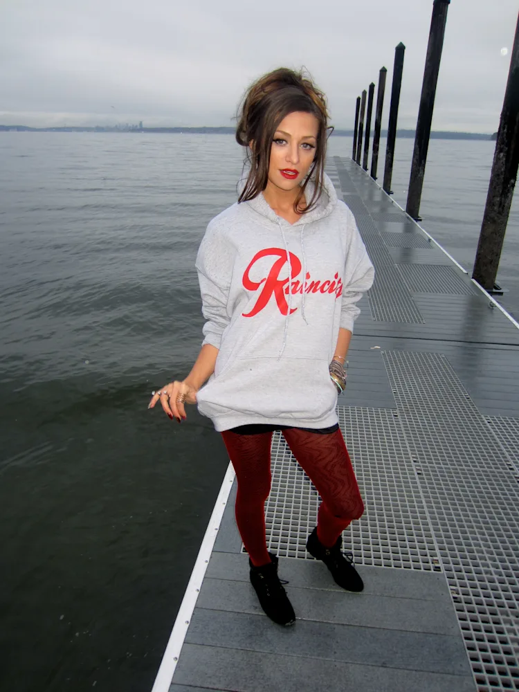 cassandra-mcclure-the-north-west-raincity-hoodie-dock-skyline-pose