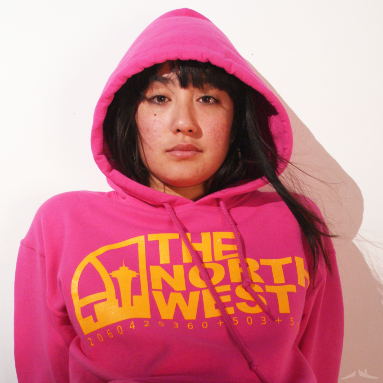 Anne rocking a pink / yellow The North West pullover hoodie