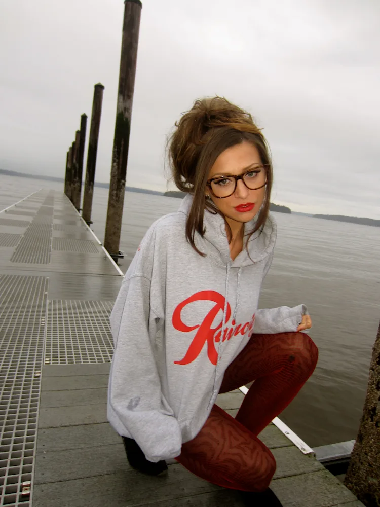 cassandra-mcclure-the-north-west-raincity-hoodie-crouched-dock-pilings