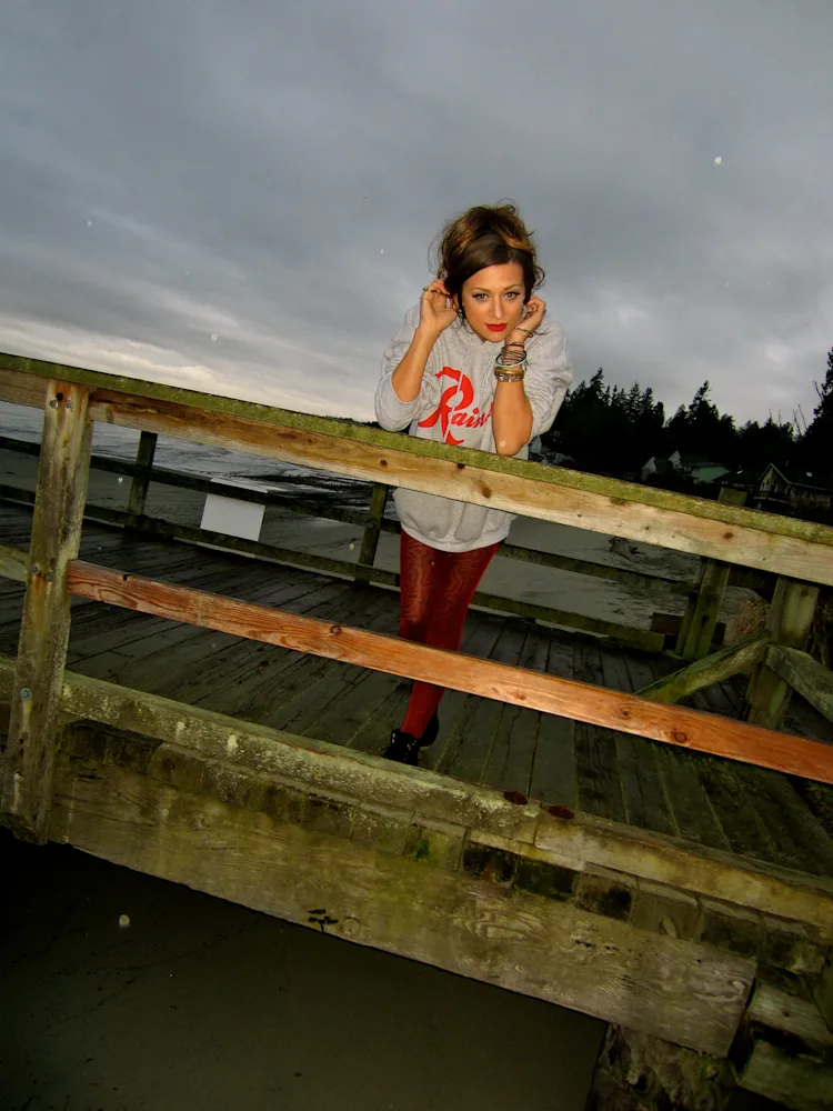 cassandra-mcclure-the-north-west-raincity-hoodie-pier-railing-dusk