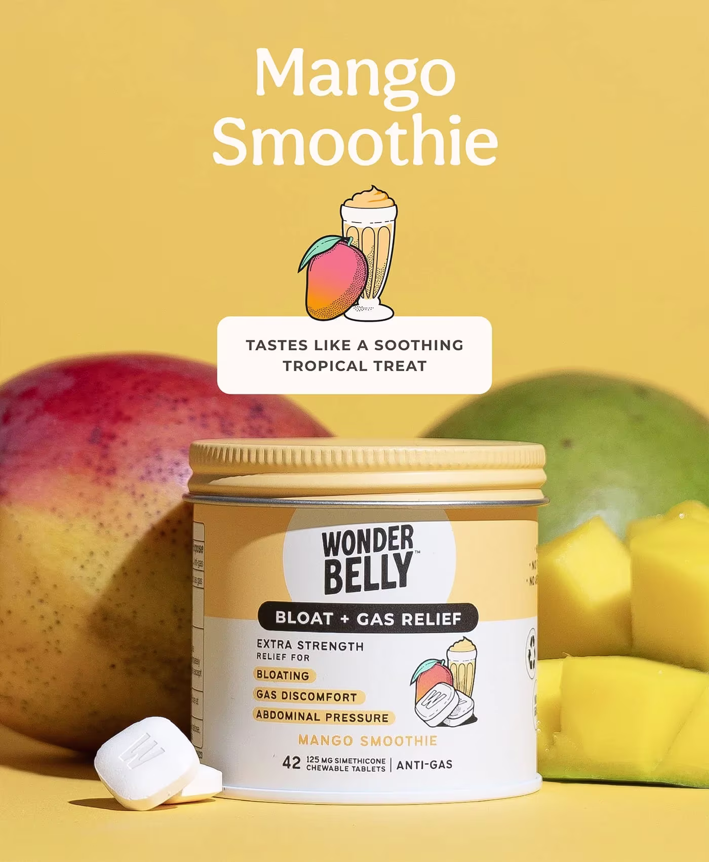 Wonderbelly bloat and gas relief container labeled “Mango Smoothie,” displayed with fresh mango fruit, mango cubes, and a white chewable tablet on a yellow background, with text reading “Tastes like a soothing tropical treat.”
