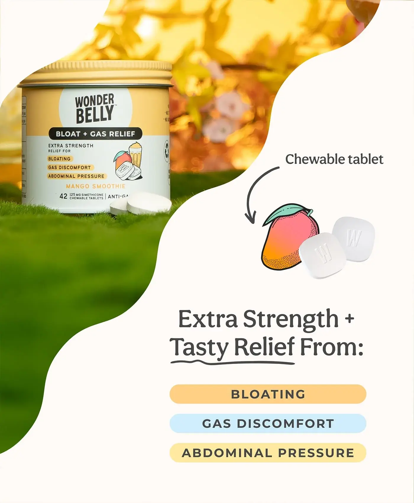 Graphic showing a Wonderbelly bloat and gas relief jar labeled “Mango Smoothie” placed on grass with chewable tablets and mango illustrations, alongside text reading “Extra Strength + Tasty Relief From: Bloating, Gas Discomfort, Abdominal Pressure.”