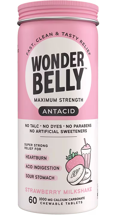 Wonderbelly maximum strength antacid bottle labeled “Strawberry Milkshake,” showing chewable calcium carbonate tablets packaging on a plain, isolated background with the full product label visible.