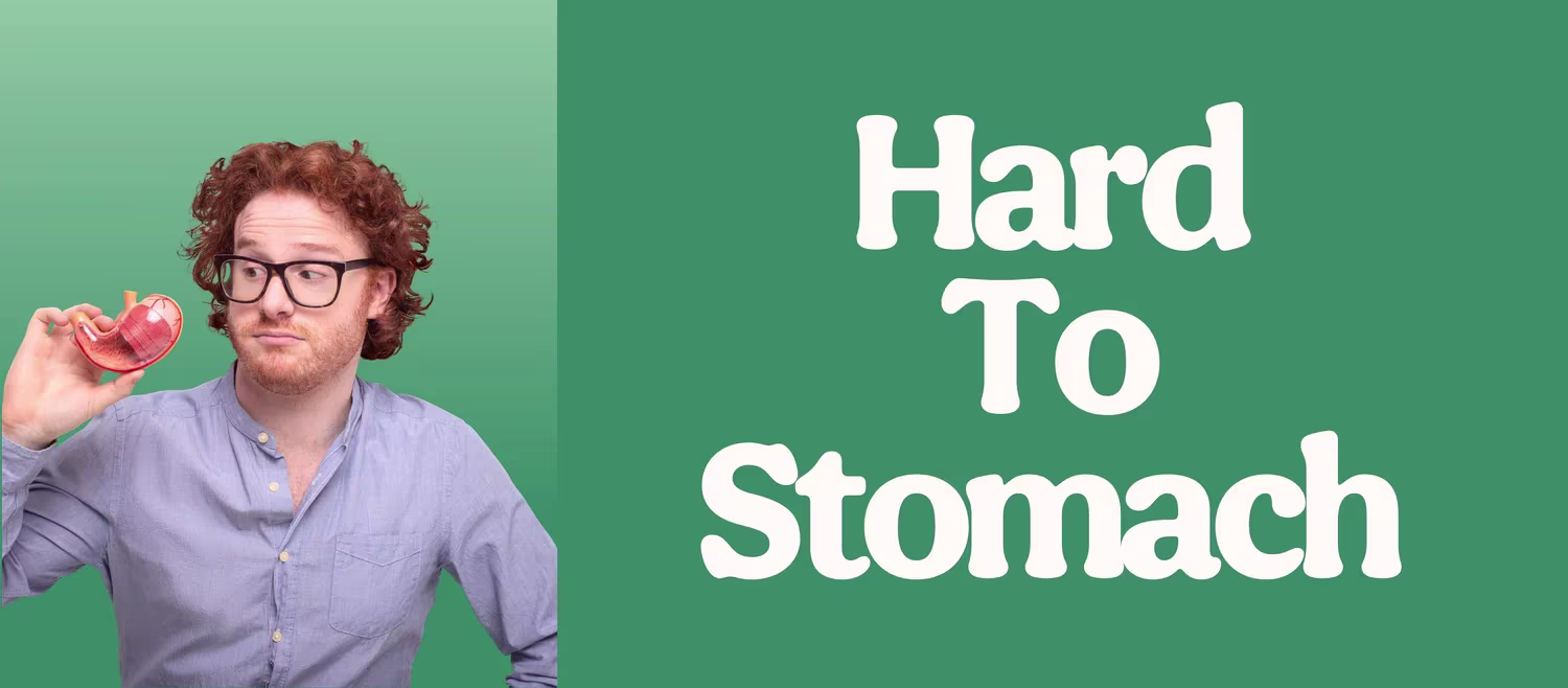 A person wearing glasses and a blue button‑down shirt holding a red anatomical stomach model, positioned beside large white text reading “Hard To Stomach” on a green background split into light and dark tones.