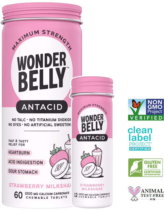 Wonderbelly maximum strength antacid in strawberry milkshake flavor, large and travel‑size bottles of calcium carbonate tablets, alongside Non‑GMO Project Verified, Clean Label Project Certified, gluten‑free and animal‑test‑free logos.