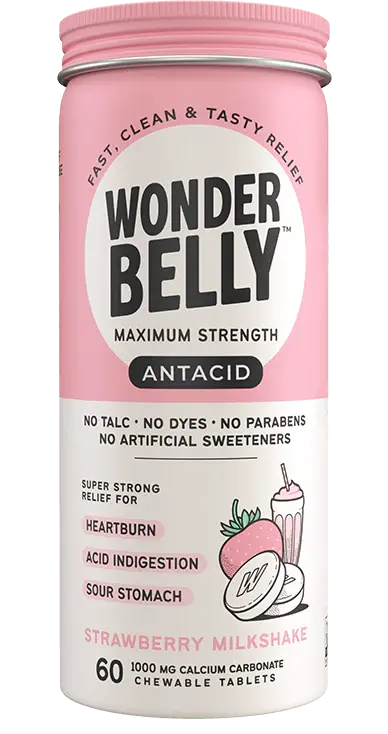 Wonderbelly maximum strength antacid bottle labeled “Strawberry Milkshake,” showing chewable calcium carbonate tablets packaging on a plain, isolated background with the full product label visible.