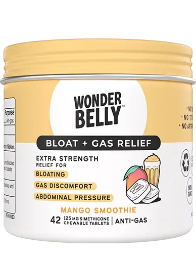 Close‑up of a Wonderbelly bloat and gas relief container labeled “Mango Smoothie,” highlighting extra‑strength relief for bloating, gas discomfort, and abdominal pressure, shown as a standalone product on a neutral background.