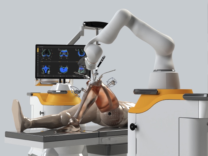 robot performing knee replacement on plastic model