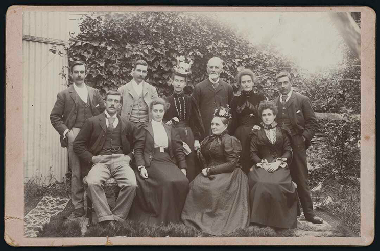 A black-and-white family photo featuring ten people.