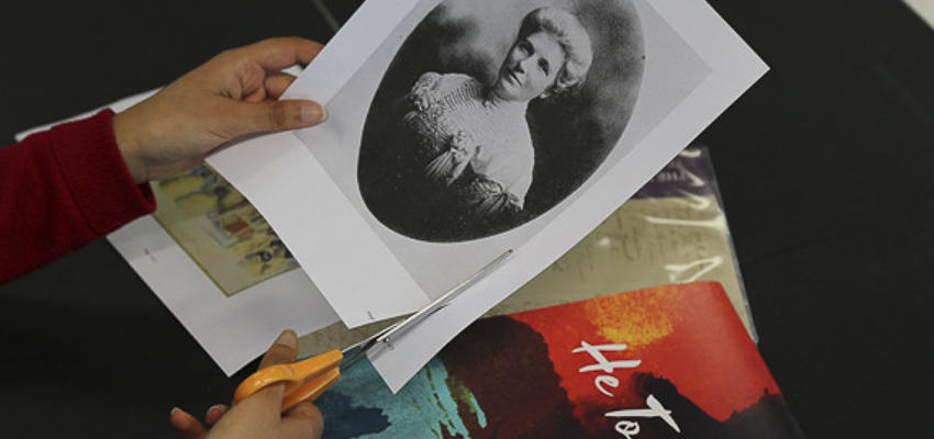 Person cutting out a portrait of Kate Sheppard.