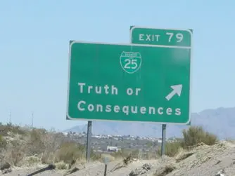 Road sign that says 'Truth or Consequences' with an arrow.